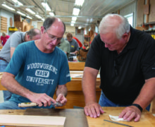 Marc Adams helps a student during a basic woodworking workshop in September 2019.